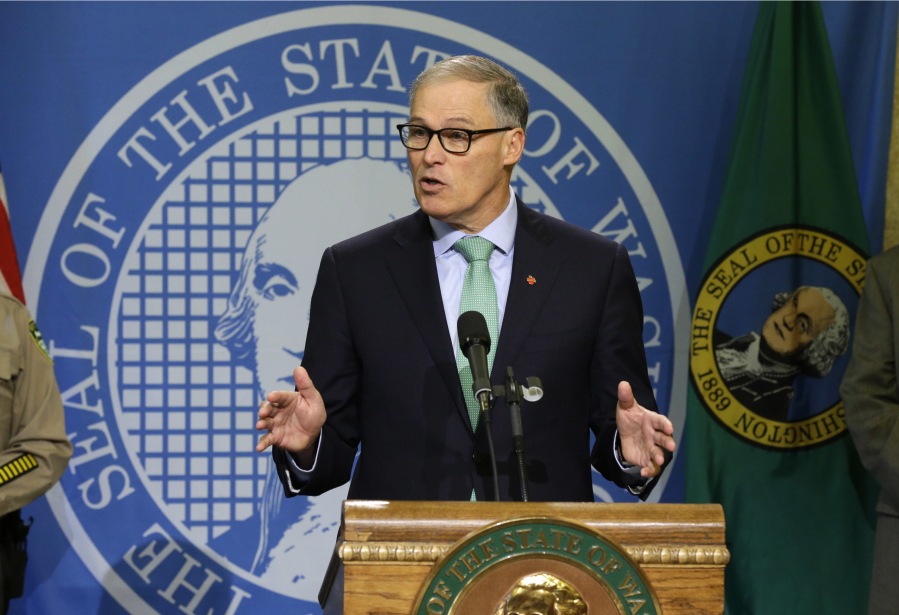 Washington Gov. Jay Inslee talks to reporters about his proposed budget, Wednesday, Dec. 14, 2016, in Olympia, Wash.  (AP Photo/Ted S.