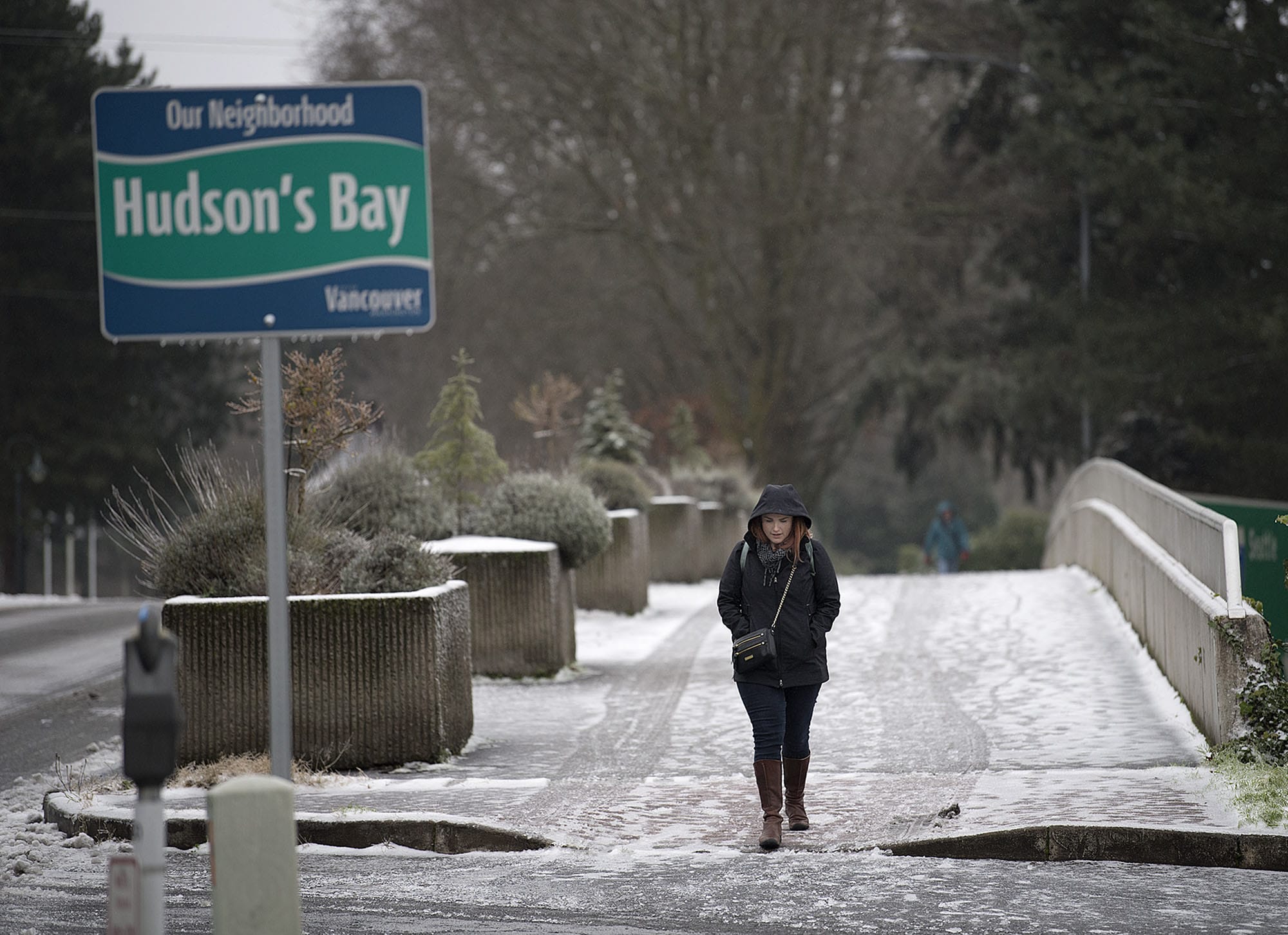 Keelie Wray of Vancouver navigates Evergreen Boulevard, which had areas of both slush and ice, Friday morning.