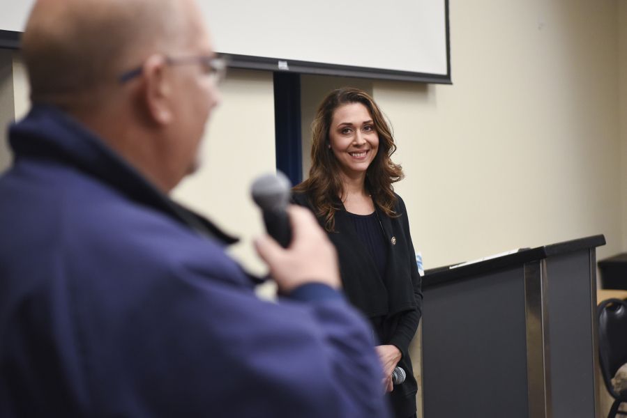 Jaime Herrera Beutler listens Tuesday to a question from David Letinich during an open town hall forum at 40 Et 8 Chateau in Vancouver on Jan. 17.