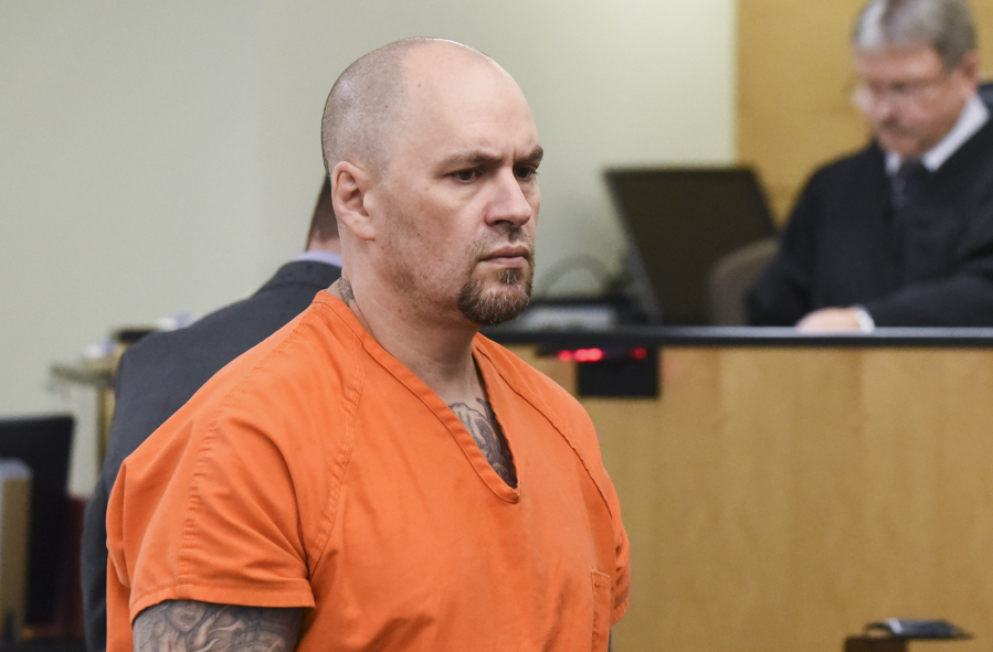Shannon Stover, who is accused of impersonating a police officer as part of a ruse to try to kidnap and rape women, appears Dec. 5 in Clark County Superior Court. Stover was arraigned Monday on multiple felony charges.
