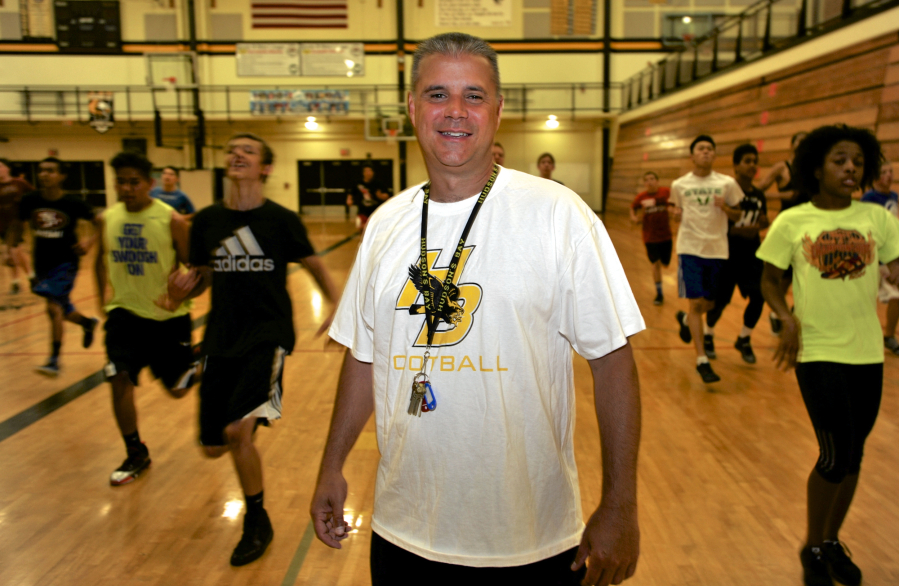 Hudson&#039;s Bay High School football coach Mark Oliverio at a gym workout for athletes at the school in Vancouver, Wa., Wednesday July 22, 2015.