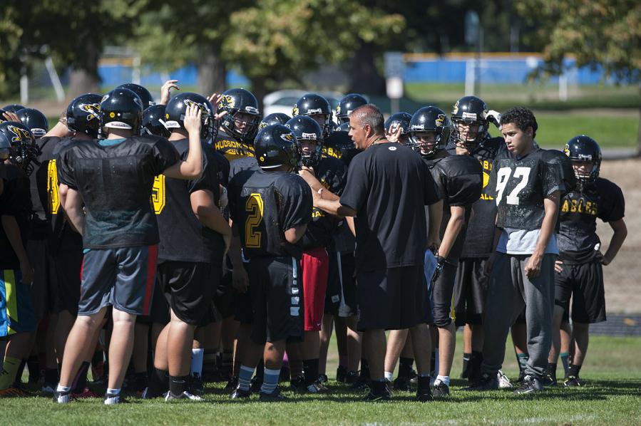 Hudson&#039;s Bay head coach Mark Oliverio works with the team during practice Thursday afternoon, Sept. 10, 2015.