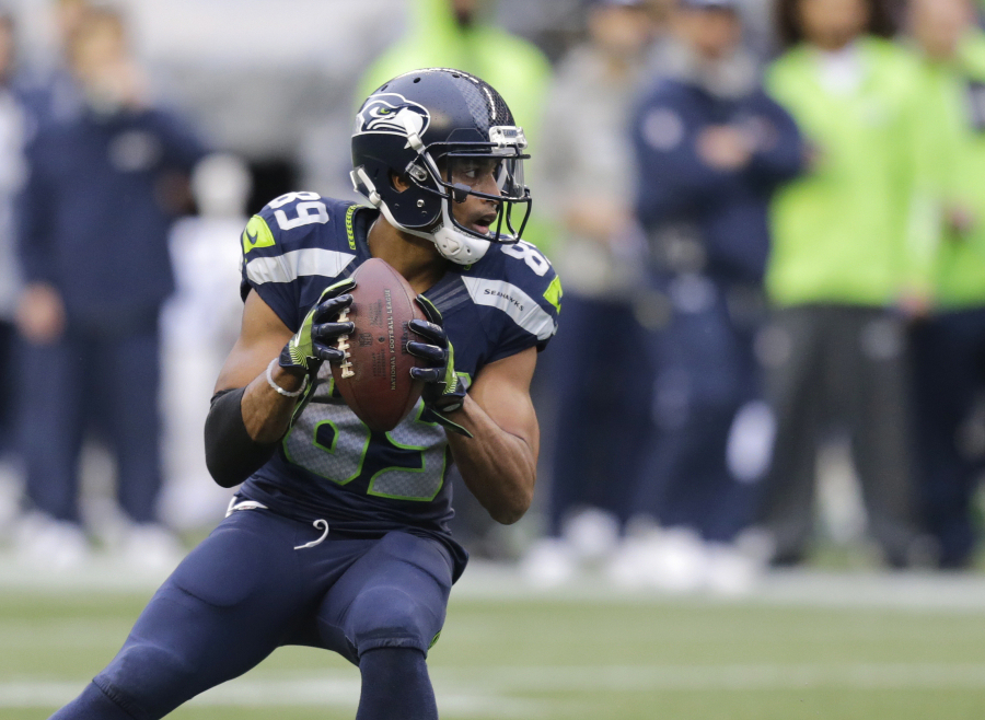 (Seattle Seahawks wide receiver Doug Baldwin gets set to pass to quarterback Russell Wilson for a touchdown against the Philadelphia Eagles in the second half of an NFL football game, Sunday, Nov. 20, 2016, in Seattle.