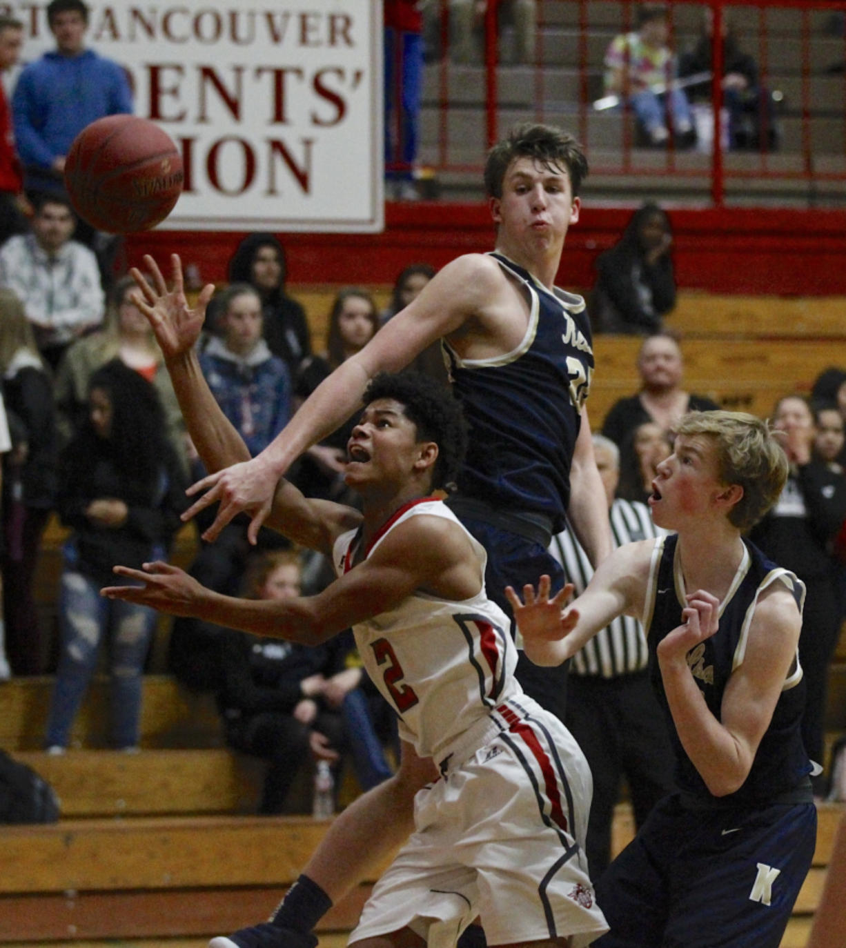 Fort Vancouver&#039;s Johnny Green, left, shoots against Kelso&#039;s Shaw Anderson, center and Reece Tack.