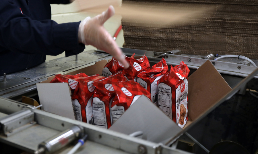 Freshly baked oatmeal raisin cookies make their way to the packaging and boxing process at Matt&#039;s Cookies on Dec. 19 in Wheeling, Ill. A longtime Chicago-area cookie brand, Matt&#039;s has changed ownership this past year. New CEO Mike Halverson hopes to grow the business using its home-style cookie theme.
