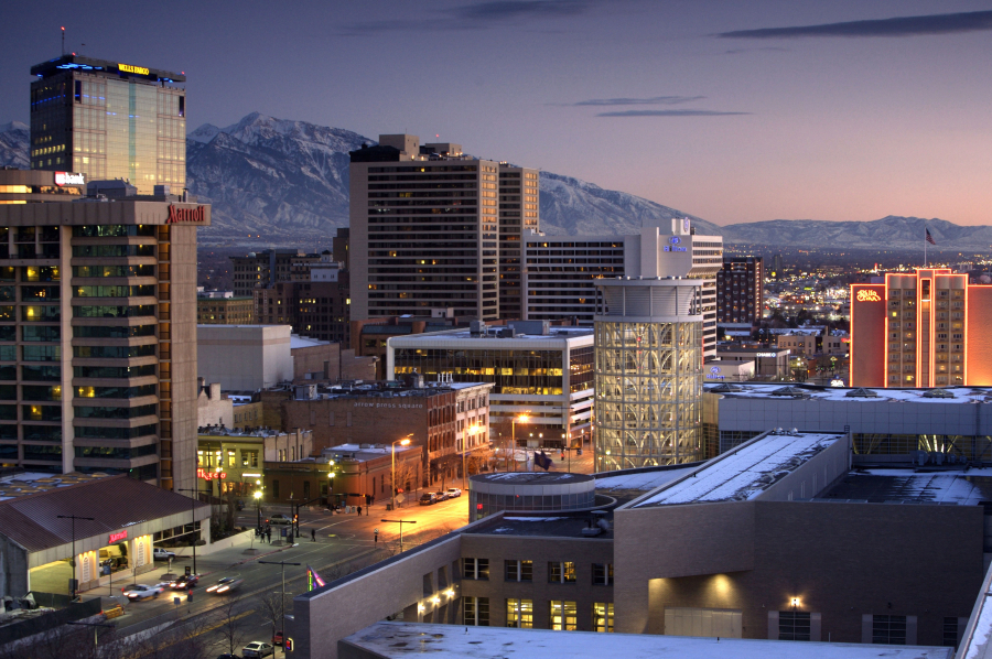 As the sun slips behind the mountains, the nighttime glow of downtown Salt Lake City begins to emerge.