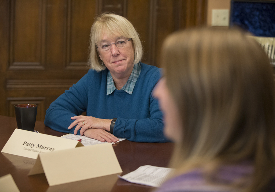 Sen. Patty Murray, left, listens as Alex Roberts of Hoesly Automotive speaks at The Marshall House on Oct. 26.