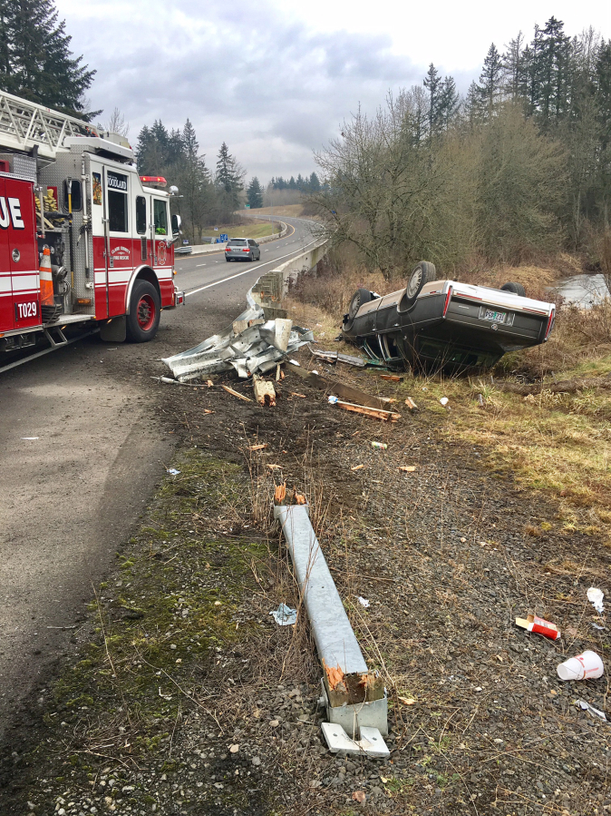 A Cadillac slammed into the corner of a guardrail Wednesday before noon near Exit 11 on Interstate 5 in Clark County.