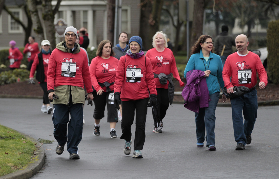 Runners and walkers raise money to help pay the power bills of those in need in the Race for Warmth 5K and 10K run/walk. Proceeds will benefit the Clark Public Utility&#039;s Operation Warm Heart program.