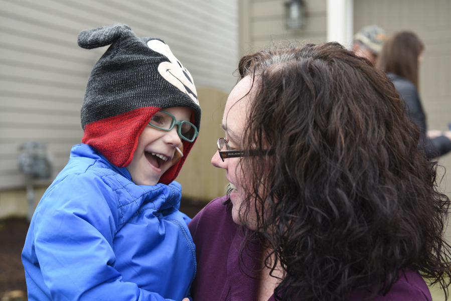 Four-year-old Nick Zadak grins in surprise as his mom, Katie Zadak, tells her son he is about to go on a ridealong with Vancouver Police Department on Wednesday.
