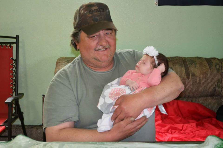Larry Bremmeyer Sr., photographed here with his granddaughter Aubree Bremmeyer, died Tuesday from complications of pneumonia.
