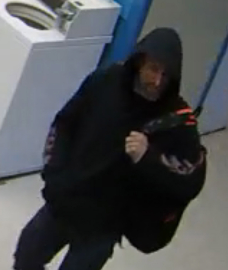 Law enforcement officials have been circulating this image, taken from an Ochards-area laundromat&#039;s surveillance video, in an attempt to identify the man pictured. He&#039;s suspected of taking cash from a soap dispenser and a pop vending machine.
