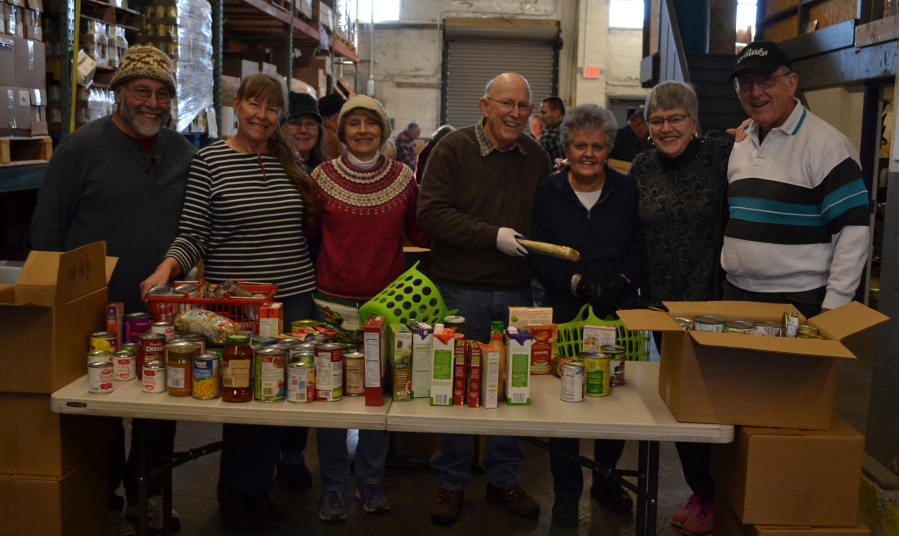 Esther Short: Members of the Happy Hoppers Square Dance Club sort through food donated to FISH of Vancouver during December&#039;s Walk &amp; Knock food drive.