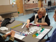 Phyllis Shierman, from left, Lucy Krantz, and Pam Kirkaldie are among a group of friends who meet to play mahjong each Thursday at the Ridgefield Community Center.