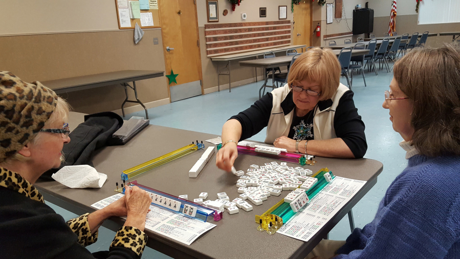 Phyllis Shierman, from left, Lucy Krantz, and Pam Kirkaldie are among a group of friends who meet to play mahjong each Thursday at the Ridgefield Community Center.