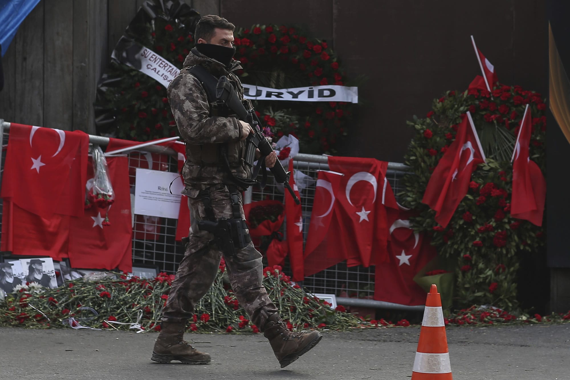 A Turkish special security force member patrols near the scene of the Reina night club following the New Year's day attack, in Istanbul, Wednesday, Jan. 4, 2017. Turkey has identified the gunman in the Istanbul nightclub massacre, the foreign minister said Wednesday as the president vowed that the country won't surrender to terrorists or become divided.