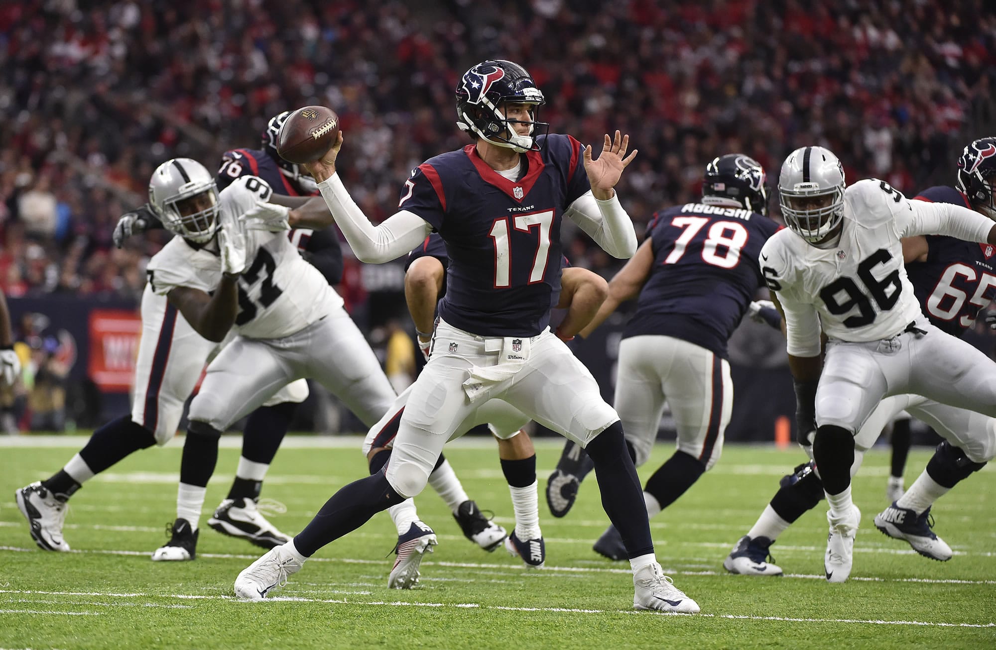Houston Texans quarterback Brock Osweiler (17) works against the Oakland Raiders during the first half of an AFC Wild Card NFL game Saturday, Jan. 7, 2017, in Houston.