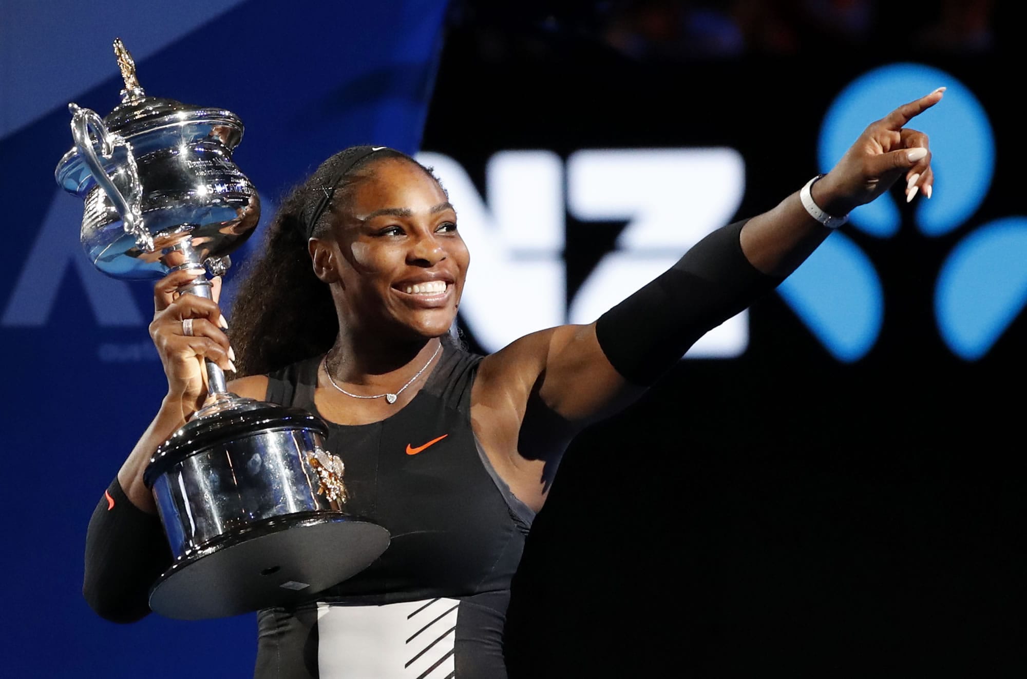 United States' Serena Williams holds her trophy after defeating her sister Venus during the women's singles final at the Australian Open tennis championships in Melbourne, Australia, Saturday, Jan. 28, 2017.
