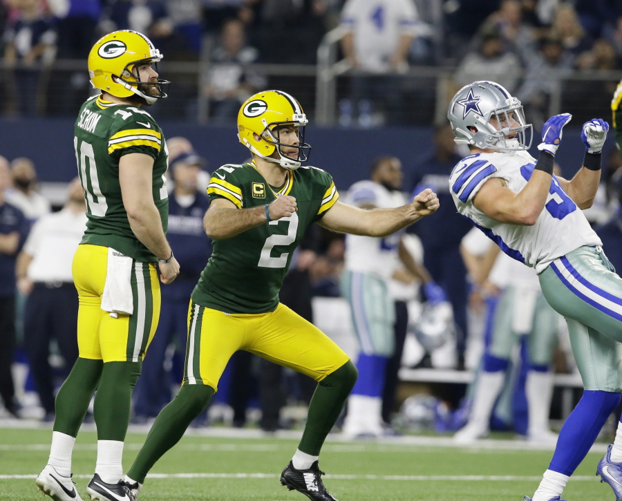 Green Bay Packers kicker Mason Crosby (2) watches his 51-yard field goal to win the game as time expires during the second half of an NFL divisional playoff football game against the Dallas Cowboys Sunday, Jan. 15, 2017, in Arlington, Texas. The Packers won 34-31.