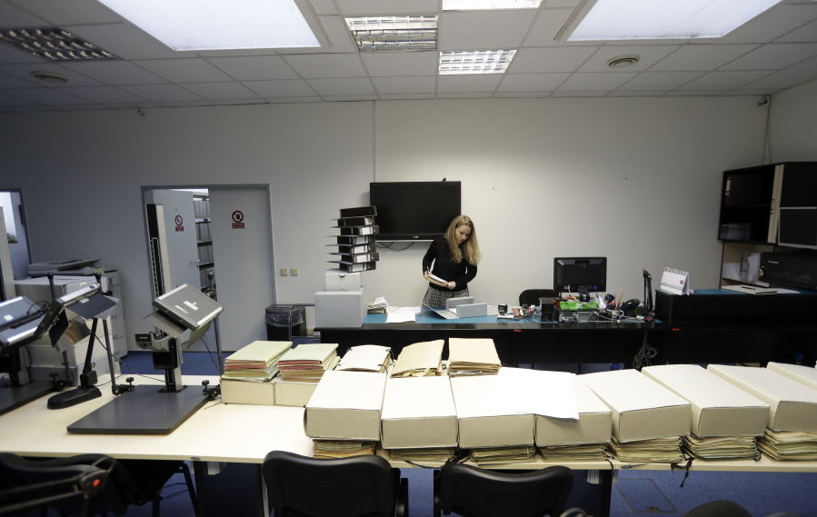 Librarian Marcela Strouhalova manages Communist-era secret police files on Ivana Trump on Tuesday at the Security Service Archive in Prague, Czech Republic.