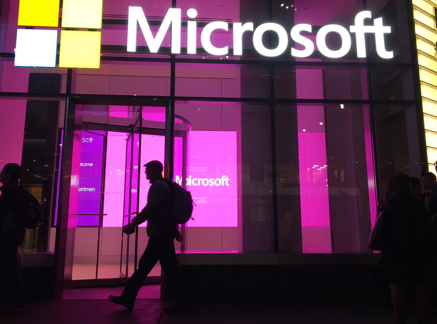 People walk near a Microsoft office in New York.