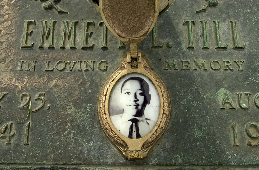 Emmett Till&#039;s grave marker  in Alsip, Ill., includes his photo, as seen May 4, 2005. The 14-year-old was tortured and killed while on a visit to Mississippi in 1955, allegedly because he had whistled at a white woman. A historian told the Associated Press on Saturday that the white woman told him in 2008 that her testimony in the trial of his killers -- her then-husband and his half-brother -- was false. (Robert A.