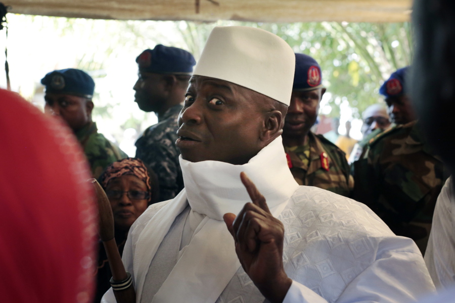 Gambia&#039;s President Yahya Jammeh shows his inked finger before voting in Banjul, Gambia, in December.