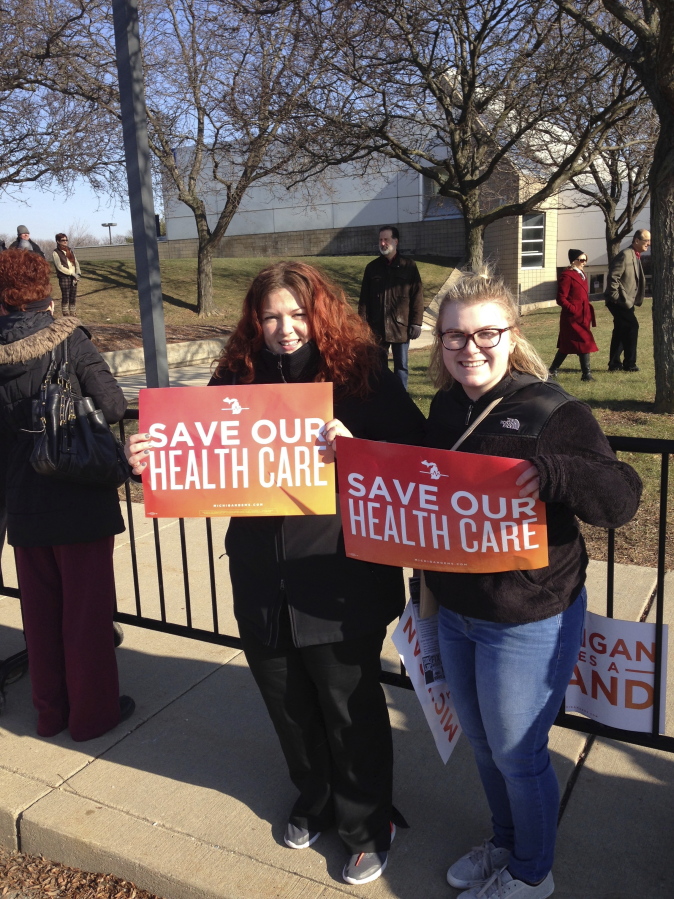 Britt Waligorski, 31, and Mary Whitfield, 18, attend an Affordable Health Act rally on Sunday, Jan. 15, 2016, in Warren, Mich. Thousands of people showed up in freezing temperatures on Sunday in Michigan where Sen. Bernie Sanders called on Americans to resist Republican efforts to repeal President Barack Obama&#039;s health care law, one of a number of rallies Democrats staged across the country to highlight opposition.