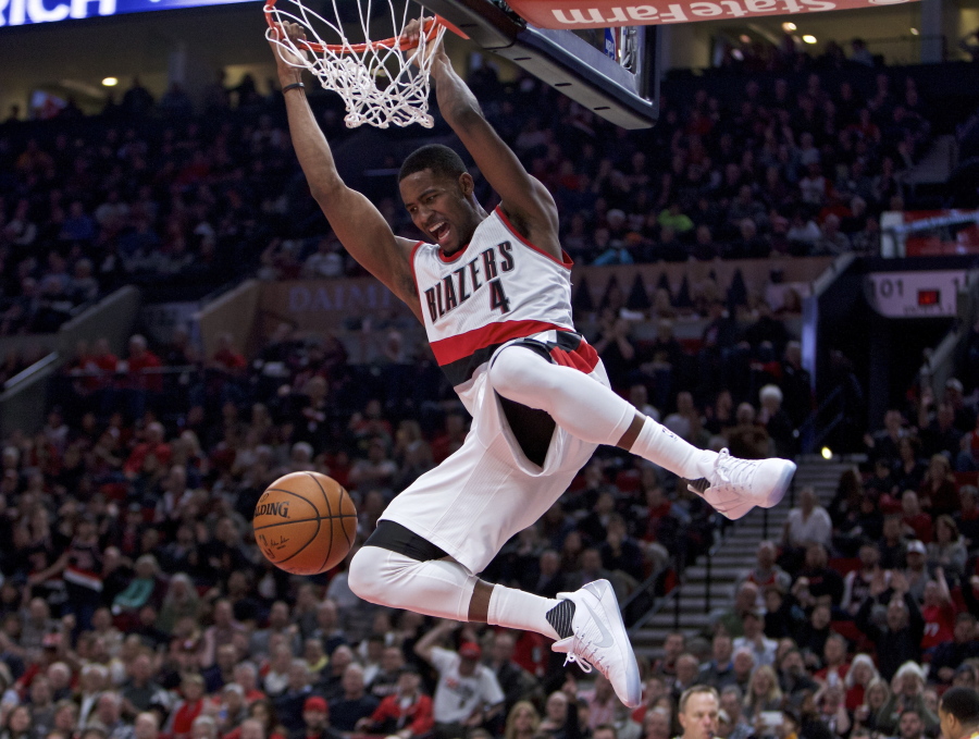 Portland Trail Blazers forward Maurice Harkless hangs from the rim after a dunk during the second half of the team&#039;s NBA basketball game against the Charlotte Hornets in Portland, Ore., Tuesday, Jan. 31, 2017. The Trail Blazers won 115-98.