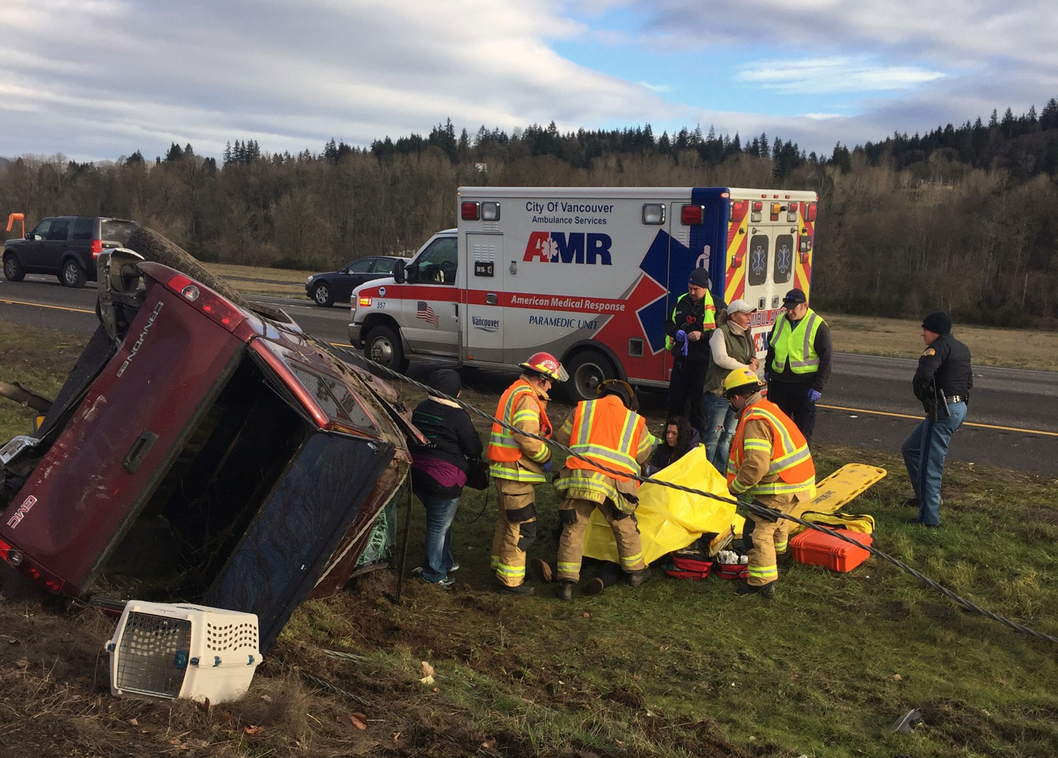 Emergency crews work Monday morning to help the driver of a pickup truck who was hurt when her vehicle was rear-ended by a suspected impaired driver on Interstate 5 in Woodland. The pickup’s driver, a Battle Ground woman, was treated and released Monday from a local hospital.