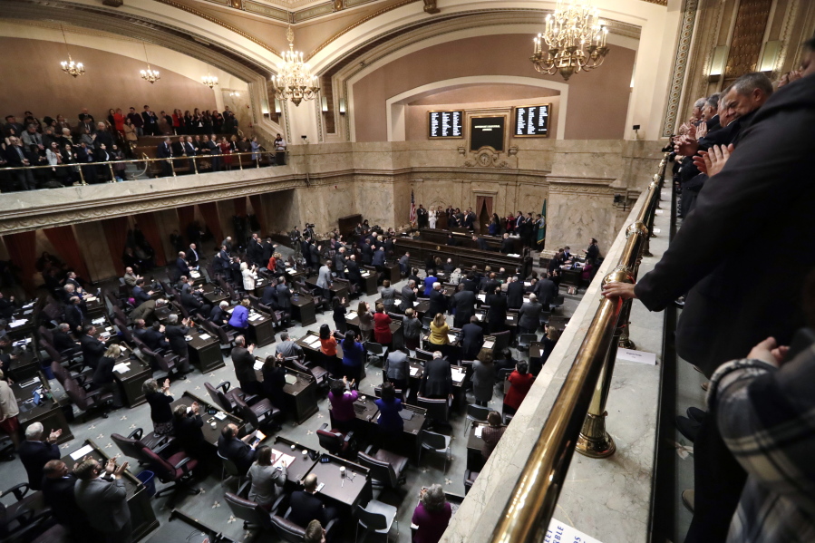 Gov. Jay Inslee is applauded during his inaugural address to a joint session of the Legislature Wednesday, Jan. 11, in Olympia.