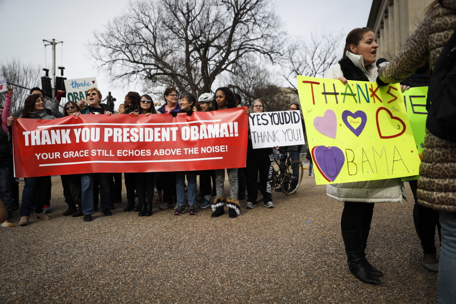 Demonstrators gather near the White House in Washington, on Thursday to thank outgoing President Barack Obama.