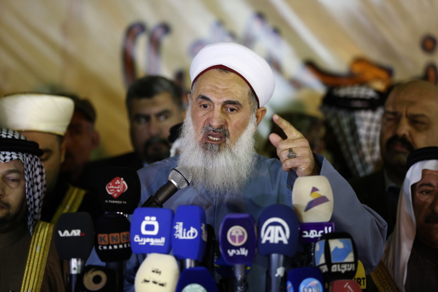 The Mufti of the Sunni Community in Iraq Sheikh Mehdi al-Sumaidaie speaks to media outlets in Baghdad, Iraq, Tuesday, January 3, 2017. Violence claimed the lives of at least 6,878 civilian Iraqis last year, the United Nations said on Monday, as the Iraqi government struggles to maintain security nationwide and to dislodge Islamic State group militants from areas under their control.