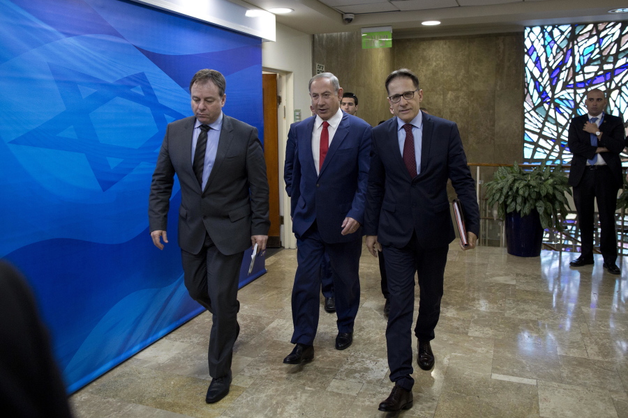 Israeli Prime Minister Benjamin Netanyahu, center, arrives to his weekly Cabinet meeting Sunday in Jerusalem.