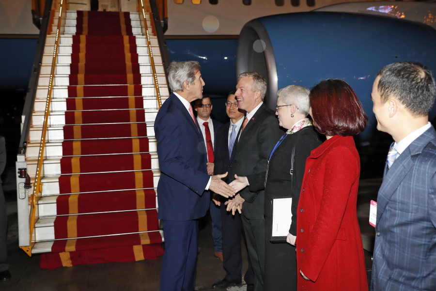 Secretary of State John Kerry is greeted by U.S. Ambassador to Vietnam Ted Osius, center, and others, as he arrives at the Hanoi Airport, Thursday, Jan. 12, 2017, in Hanoi, Vietnam.