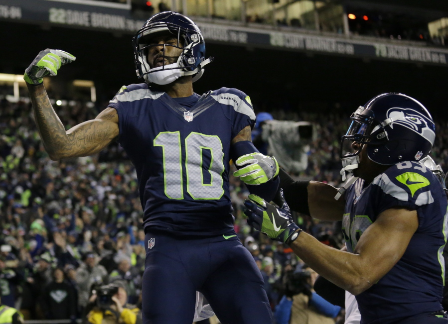 Seahawks receiver Paul Richardson (10) celebrates with Doug Baldwin after Richardson caught a pass for a touchdown during Seattle&#039;s win over the Lions.