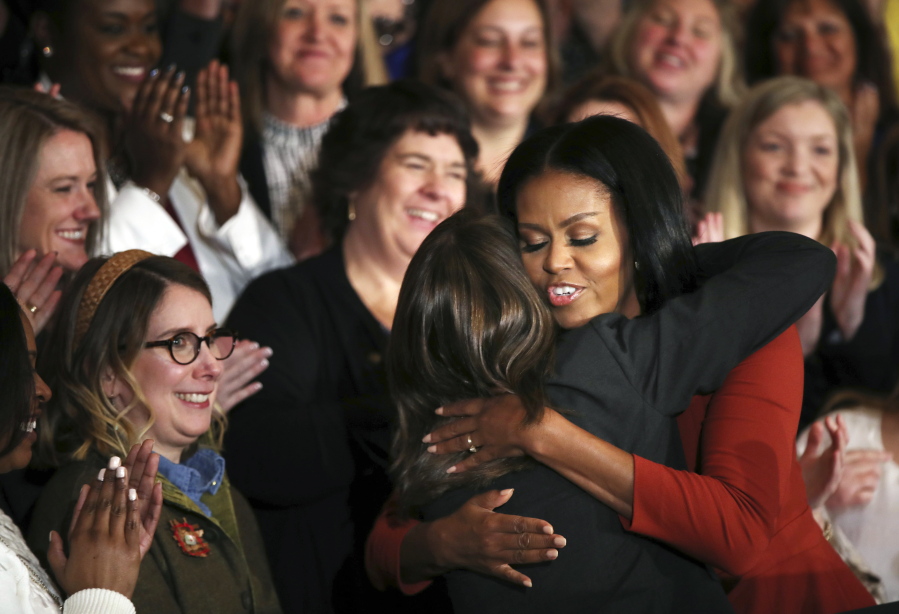 First lady Michelle Obama hugs 2017 School Counselor of the Year Terri Tchorzynski on Friday after her final speech as first lady. She spoke at the School Counselor of the Year ceremony at the White House .