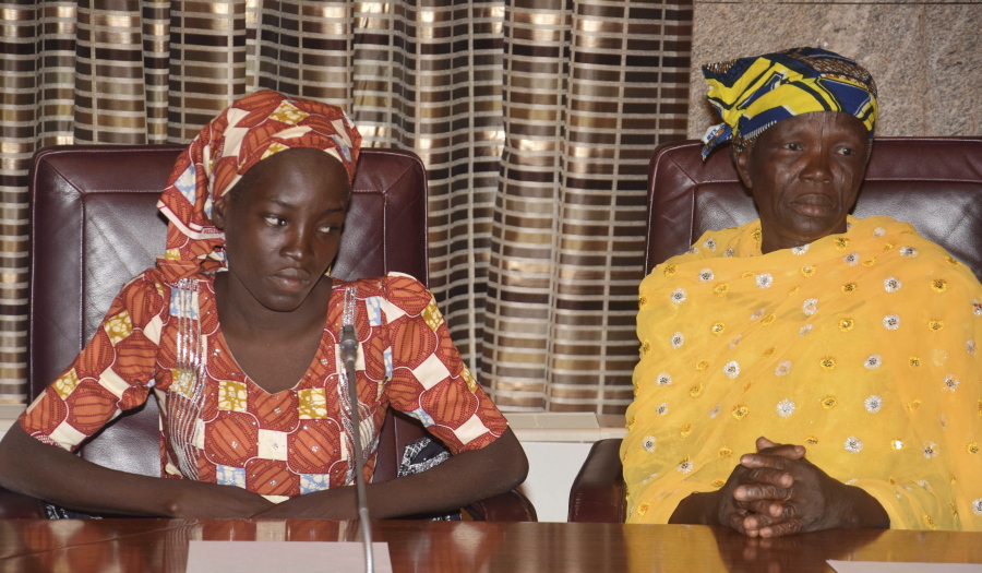 Amina Ali, left, the first rescued Chibok schoolgirl, and her mother, Binta Ali Nkeki attend a meeting with Nigeria&#039;s President Muhammadu Buhari at the Presidential palace in Abuja, Nigeria. She was found wandering in a forest, the first of the nearly 300 Chibok schoolgirls kidnapped by Boko Haram to escape on her own and reach freedom. Since then, Amina Ali Nkeki has been sequestered by Nigeria&#039;s secret intelligence agency. Sunday Jan. 8, 2017 marks 1,000 days since the mass kidnapping, and most of the Chibok schoolgirls remain in captivity.