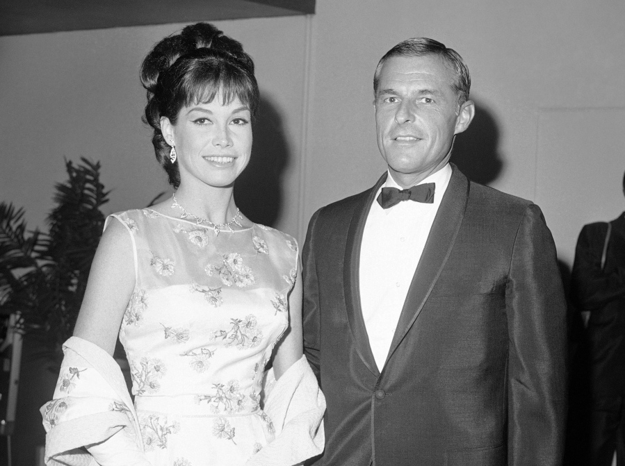Mary Tyler Moore and then-husband Grant Tinker appear May 22, 1966, at the Emmy Awards in Los Angeles.