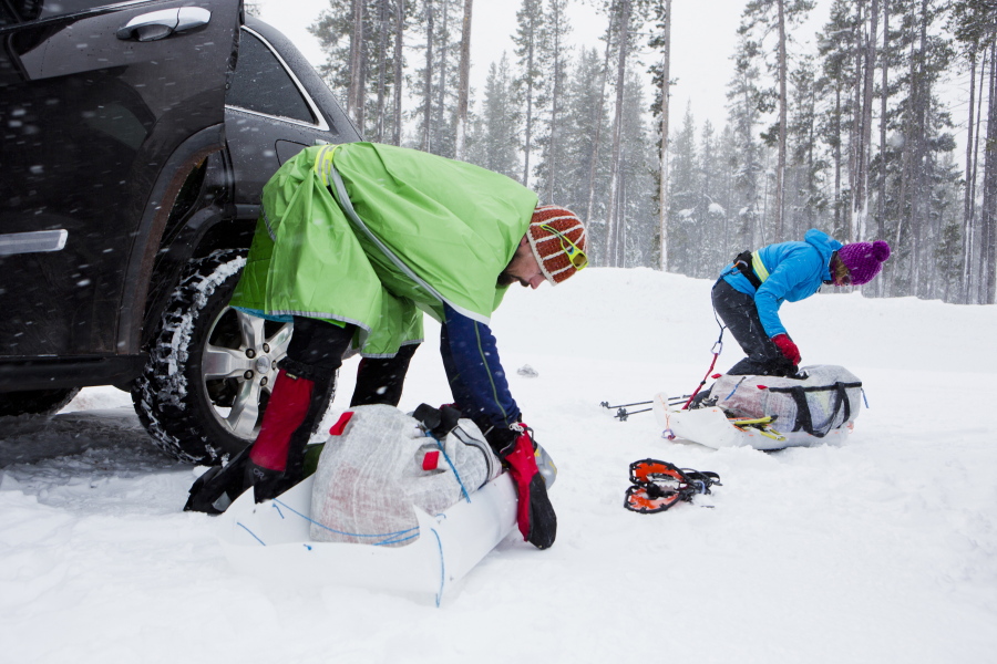 Chris and Helen Scotch assemble their gear -- enough to survive for several days in the elements of northern Minnesota in January -- into the sleds they plan to pull as they run 135 miles.