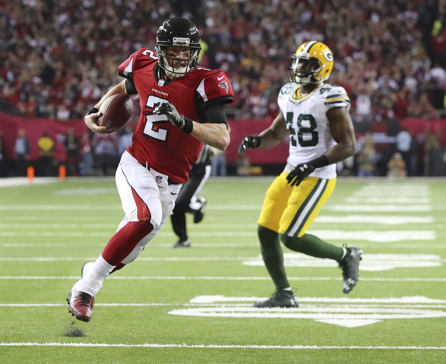 Atlanta Falcons&#039; Matt Ryan runs for a touchdown during the first half of the NFL football NFC championship game against the Green Bay Packers, Sunday, Jan. 22, 2017, in Atlanta.