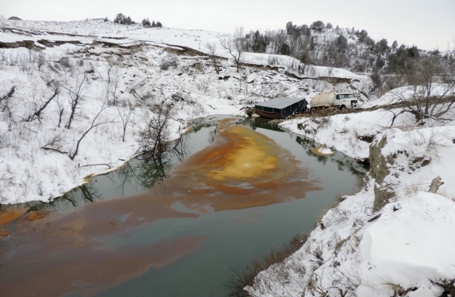 An oil spill from the Belle Fourche Pipeline fouls Ash Coulee Creek, a tributary of the Little Missouri River, on Dec. 10 near Belfield, N.D.