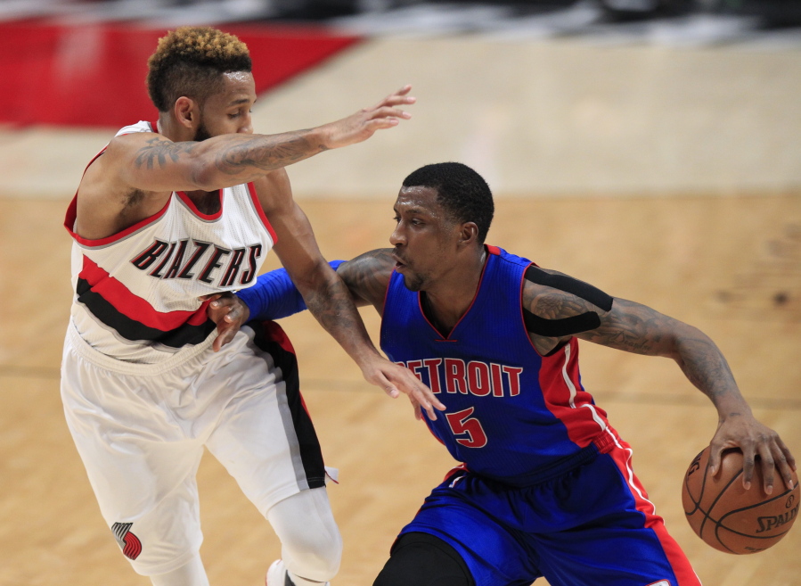 Detroit Pistons guard Kentavious Caldwell-Pope, right, drives on Portland Trail Blazers guard Allen Crabbe during the first half of an NBA basketball game in Portland, Ore., Sunday, Jan. 8, 2017.