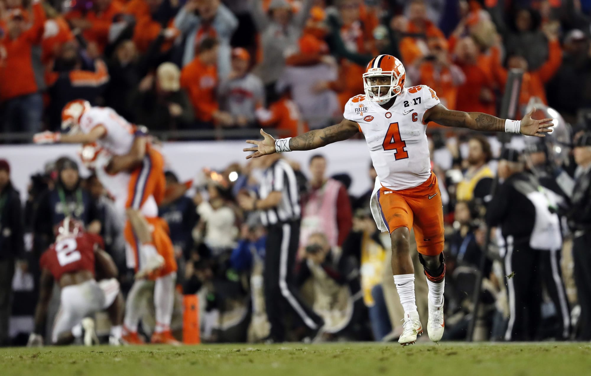 Clemson's Deshaun Watson celebrates a last second touchdown pass to Hunter Renfrow during the second half of the NCAA college football playoff championship game against Alabama Tuesday, Jan. 10, 2017, in Tampa, Fla.