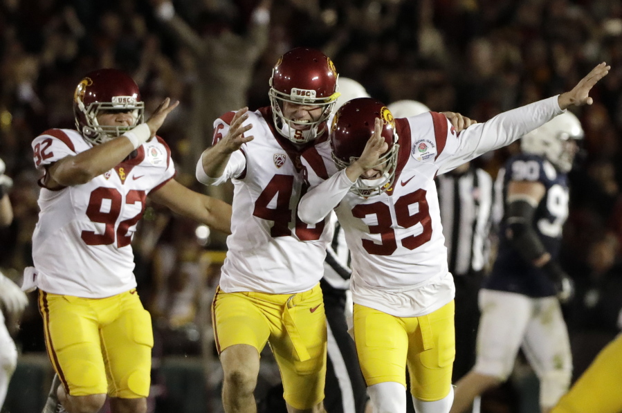 Southern California place kicker Matt Boermeester, right, celebrates after the game winning field goal against Penn State during the second half of the Rose Bowl NCAA college football game Monday, Jan. 2, 2017, in Pasadena, Calif.