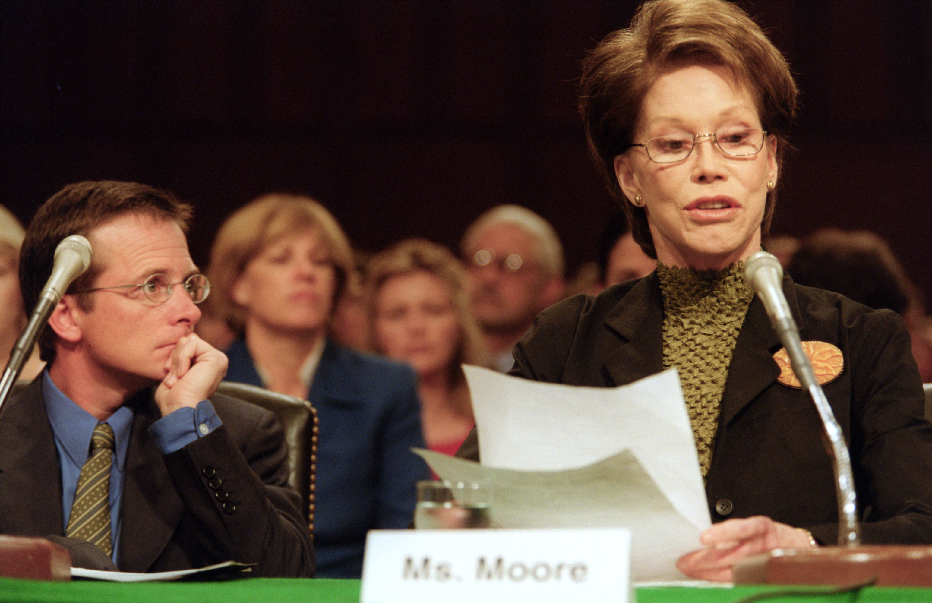 Actor Michael J. Fox looks on as actress Mary Tyler Moore testifies on Capitol Hill on Sept. 14, 2000, before a Senate Appropriations subcommittee hearing on stem cell research. They urged the subcommittee to release federal funding for research involving embryonic stem cells, which they said could lead to cures for diseases such as Parkinson's, juvenile diabetes and Alzheimer's.