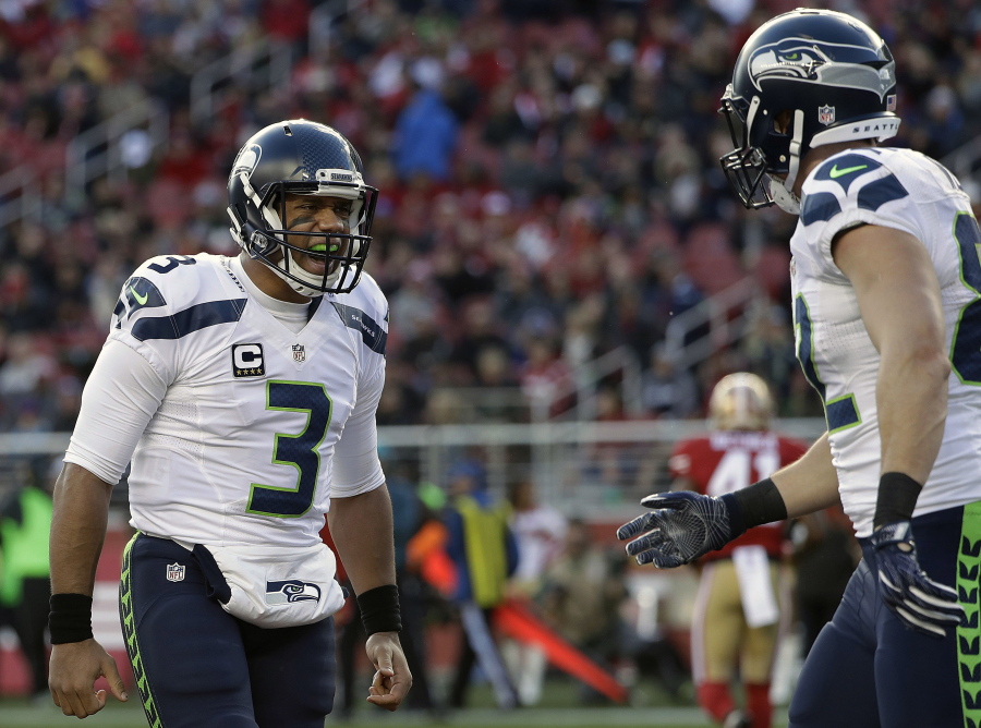 Seattle Seahawks quarterback Russell Wilson (3) and tight end Luke Willson, right, celebrate after connecting on a touchdown pass against the San Francisco 49ers during the first half of an NFL football game in Santa Clara, Calif., Sunday, Jan. 1, 2017.