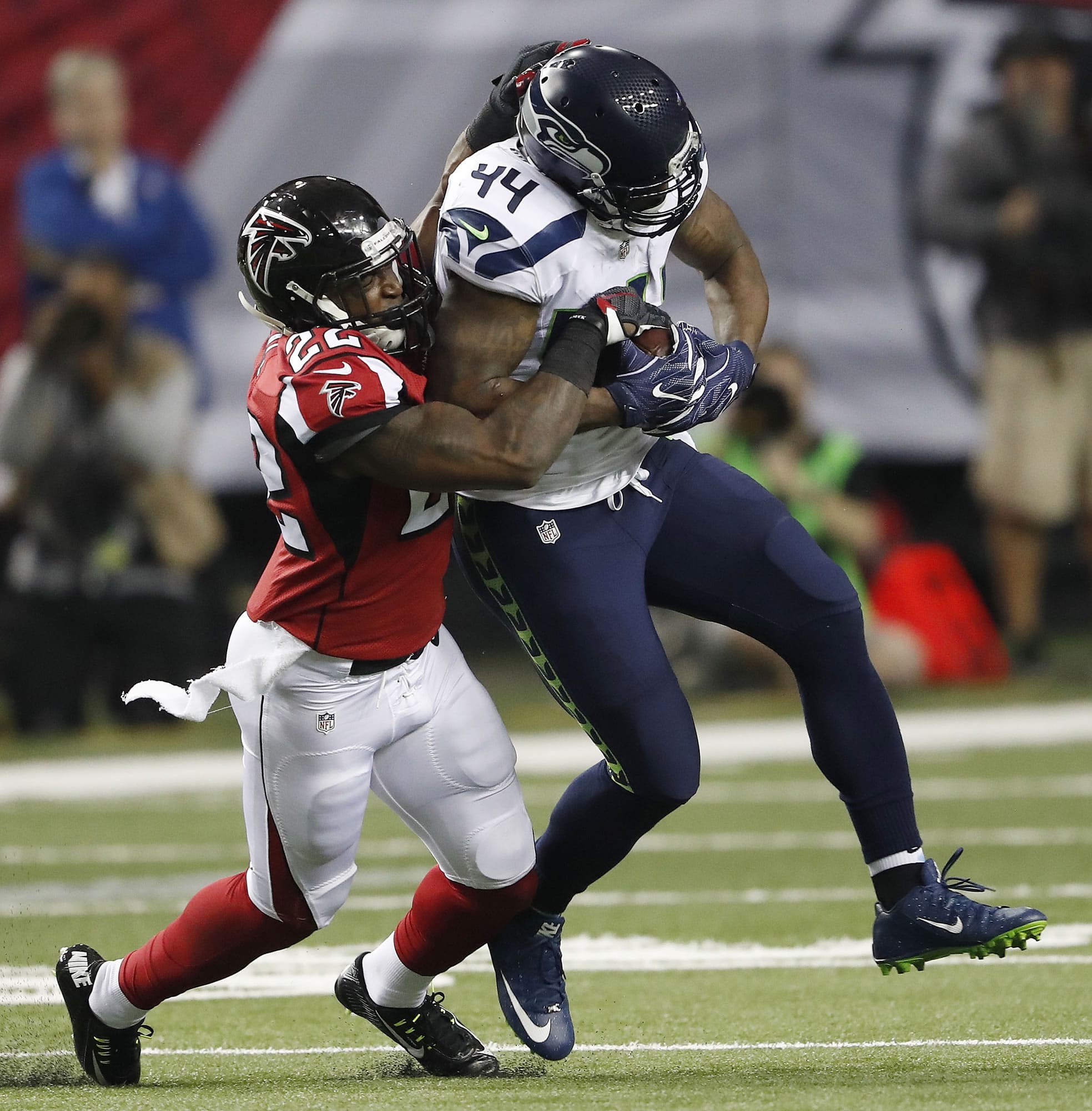 Seattle Seahawks fullback Marcel Reece (44) runs against Atlanta Falcons strong safety Keanu Neal (22) during the first half of an NFL football NFC divisional playoff game, Saturday, Jan. 14, 2017, in Atlanta.