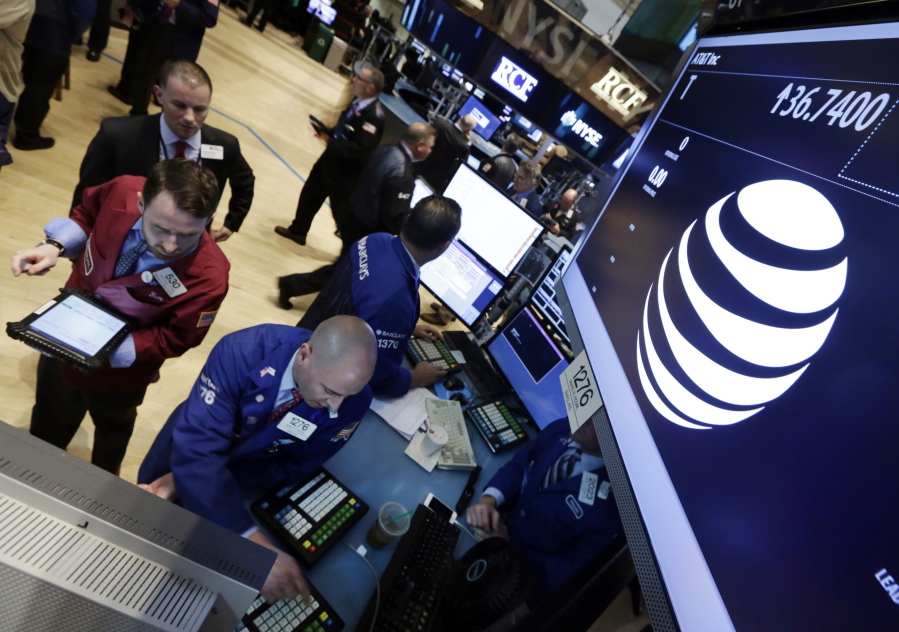 Traders gather in 2014, at the post that handles AT&amp;T on the floor of the New York Stock Exchange. AT&amp;T says the market for its new internet cable service, DirecTV Now, could be as large as 20 million households.