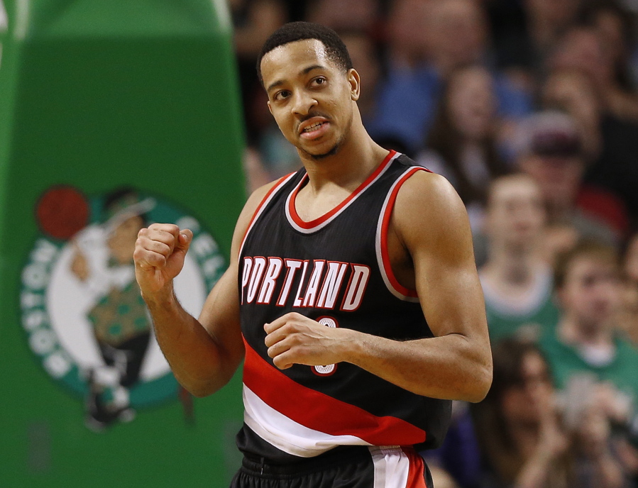 Portland Trail Blazers&#039; C.J. McCollum pumps his fist during the final moments of their 127-123 overtime win over the Boston Celtics in an NBA basketball game in Boston Saturday, Jan. 21, 2017.